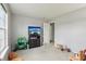 Neutral bedroom with a TV, toys and view into closet at 7157 Chemistry Ct, Indianapolis, IN 46239