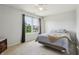 Bedroom featuring a ceiling fan, window, neutral walls and bed at 7157 Chemistry Ct, Indianapolis, IN 46239