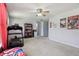 Bedroom with a treadmill, mini fridge, and doorway to a stairway at 7157 Chemistry Ct, Indianapolis, IN 46239