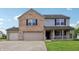 Lovely two-story home showcasing a brick facade, light gray siding, and a covered porch at 7157 Chemistry Ct, Indianapolis, IN 46239