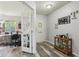 Inviting entryway with wood flooring, a work-from-home area, and charming decor at 7157 Chemistry Ct, Indianapolis, IN 46239