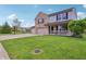 A well-manicured lawn leads to the home's facade with a basketball hoop over the driveway at 7157 Chemistry Ct, Indianapolis, IN 46239