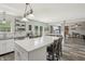 Open kitchen with white cabinets and large island at 7157 Chemistry Ct, Indianapolis, IN 46239