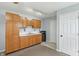 Functional kitchen featuring wooden cabinets and essential appliances at 7157 Chemistry Ct, Indianapolis, IN 46239