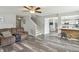 Spacious living room with hardwood floors and staircase access at 7157 Chemistry Ct, Indianapolis, IN 46239