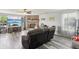 Comfortable living room features a ceiling fan, a brick fireplace, and a mounted television at 7157 Chemistry Ct, Indianapolis, IN 46239