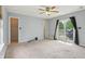 Bright living room with a view of the swimming pool and backyard at 7157 Chemistry Ct, Indianapolis, IN 46239