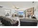 Open-concept living room with a fireplace, a large TV, and a view into the kitchen at 7157 Chemistry Ct, Indianapolis, IN 46239