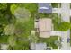 Aerial view of a home with a well-maintained lawn, patio area, and mature trees in a residential neighborhood at 7249 Tappan Dr, Indianapolis, IN 46268
