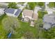 Aerial view of backyard featuring lawn and mature trees at 7249 Tappan Dr, Indianapolis, IN 46268
