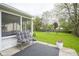 Spacious backyard featuring a patio with outdoor seating and lush greenery at 7249 Tappan Dr, Indianapolis, IN 46268