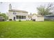 View of backyard and exterior with a large shed at 7249 Tappan Dr, Indianapolis, IN 46268