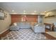 Basement living room with a plush sectional sofa, stylish area rug, and ample space at 7249 Tappan Dr, Indianapolis, IN 46268