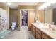 Bathroom featuring double sinks and an open closet space for storage at 7249 Tappan Dr, Indianapolis, IN 46268