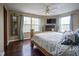Spacious bedroom with hardwood floors, large windows and a ceiling fan for added comfort at 7249 Tappan Dr, Indianapolis, IN 46268