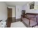 Cozy Bedroom featuring a wooden crib, plush rug, and calming decor at 7249 Tappan Dr, Indianapolis, IN 46268