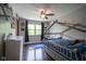 Charming bedroom featuring space themed decorations, shelves, and a window at 7249 Tappan Dr, Indianapolis, IN 46268