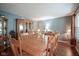 Traditional dining room features a large wooden table, china cabinet, and hardwood floors at 7249 Tappan Dr, Indianapolis, IN 46268