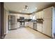 Bright kitchen with stainless steel appliances, ample cabinetry, and tile flooring at 7249 Tappan Dr, Indianapolis, IN 46268