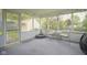 Enclosed porch featuring cushioned seating with a view of the backyard at 7249 Tappan Dr, Indianapolis, IN 46268