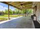 Large backyard patio with string lights, a ceiling fan, and a view of the yard at 7285 E County Road 900 N, Brownsburg, IN 46112