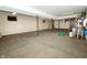 Spacious unfinished basement with concrete floor, support beams, and water heater at 7285 E County Road 900 N, Brownsburg, IN 46112