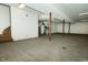 Unfinished basement with concrete floor, support beams, stairs, and mechanicals at 7285 E County Road 900 N, Brownsburg, IN 46112