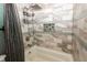 Shower/tub features gray tile, built-in niche, shower curtain and modern fixtures at 7285 E County Road 900 N, Brownsburg, IN 46112
