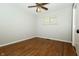 Bedroom with hardwood floors, light gray walls, a window with blinds, and ceiling fan at 7285 E County Road 900 N, Brownsburg, IN 46112