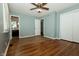 Bedroom with hardwood floors, ceiling fan, closet space and access to the bathroom at 7285 E County Road 900 N, Brownsburg, IN 46112