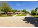 Charming home featuring a graveled drive, well-manicured lawn, and mature shade trees at 7285 E County Road 900 N, Brownsburg, IN 46112