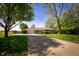 Charming ranch home with mature trees, a long driveway, and a well-maintained front lawn at 7285 E County Road 900 N, Brownsburg, IN 46112