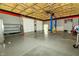 Large garage with two garage doors, high ceilings, an auto lift, and plenty of space at 7285 E County Road 900 N, Brownsburg, IN 46112