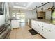 Bright kitchen with white cabinets, stainless steel appliances, and backyard view at 7285 E County Road 900 N, Brownsburg, IN 46112