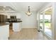 Kitchen with dining area, stainless appliances, and sliding glass doors to the backyard at 7285 E County Road 900 N, Brownsburg, IN 46112