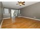 Spacious living room with beautiful hardwood floors, neutral walls, and natural light at 7285 E County Road 900 N, Brownsburg, IN 46112