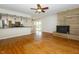 Open floor plan with wood flooring connecting the living room with the kitchen and dining area at 7285 E County Road 900 N, Brownsburg, IN 46112