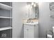 Bathroom vanity with a white sink cabinet and a mirrored medicine cabinet at 744 Gilbert Ave, Indianapolis, IN 46227