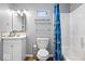 Bathroom features a toilet, vanity with a sink, tub, and tiled walls at 744 Gilbert Ave, Indianapolis, IN 46227