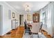 Traditional dining room featuring hardwood floors, a round wood table, chandelier and window with curtains at 744 Gilbert Ave, Indianapolis, IN 46227