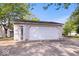 Detached garage exterior with white siding and a welcome sign at 744 Gilbert Ave, Indianapolis, IN 46227
