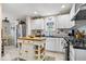 Bright kitchen with white cabinets, a kitchen island, and stainless steel appliances at 744 Gilbert Ave, Indianapolis, IN 46227