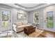 Sun-filled living room featuring neutral tones, comfortable seating, and access to the backyard at 744 Gilbert Ave, Indianapolis, IN 46227