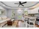 Open-concept living area with a modern kitchen, dining space, and comfortable seating at 744 Gilbert Ave, Indianapolis, IN 46227