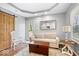 Bright living area with a rustic barn door, soft seating, and a view of the outdoors at 744 Gilbert Ave, Indianapolis, IN 46227