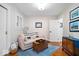 Cozy living room featuring a comfortable couch, stylish decor, and hardwood floors at 744 Gilbert Ave, Indianapolis, IN 46227