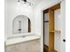 Bathroom featuring granite countertops, a closet and a classic arched mirror at 7642 Lancer Ln, Lawrence, IN 46226