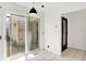 Bright breakfast nook featuring tile floors and glass patio doors offering natural light at 7642 Lancer Ln, Lawrence, IN 46226