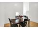 Dining room with wood floors, large windows, and a high ceiling at 7642 Lancer Ln, Lawrence, IN 46226