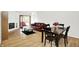 Open concept living room featuring hardwood floors, fireplace and large sofa at 7642 Lancer Ln, Lawrence, IN 46226